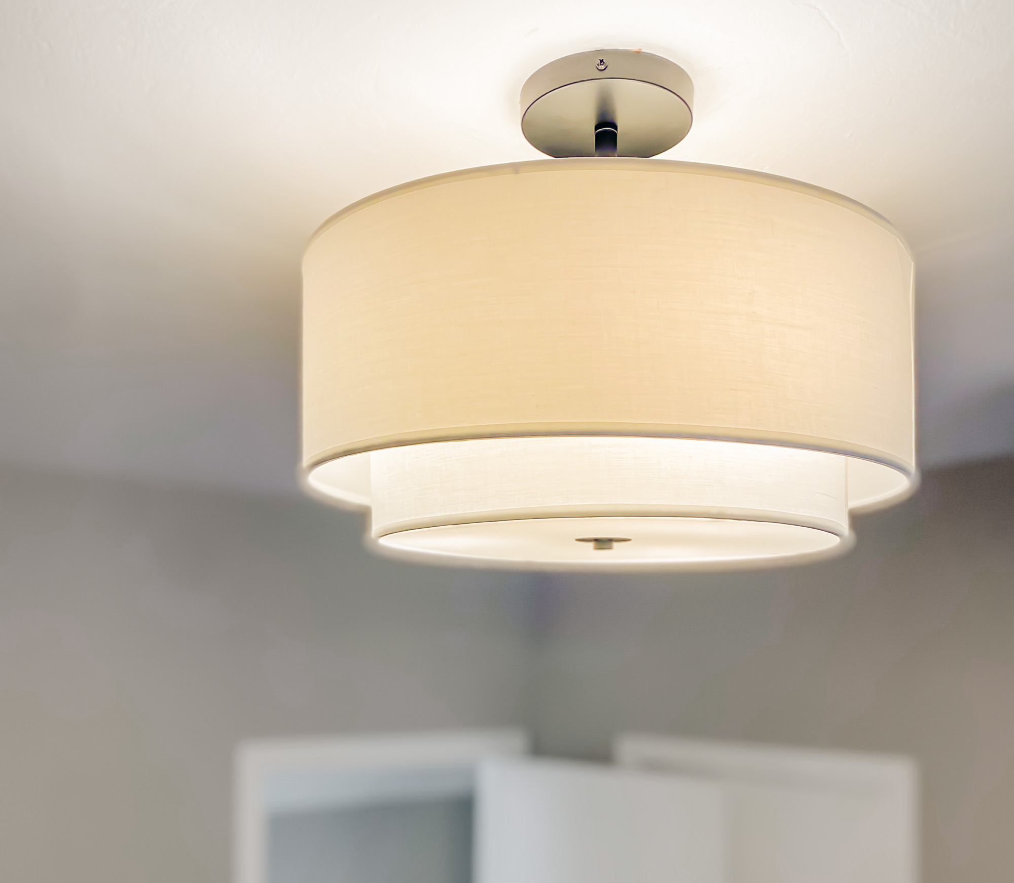 Ceiling light fixture in a Cesar House common area