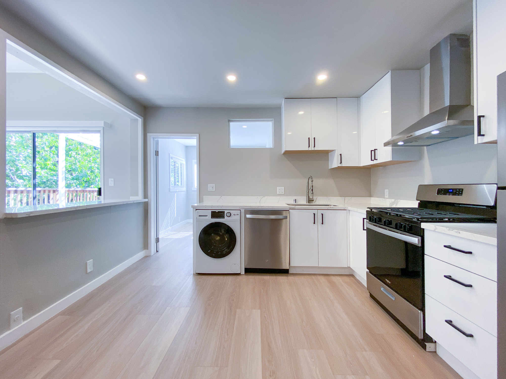 Apartment 2 kitchen with washer and dryer